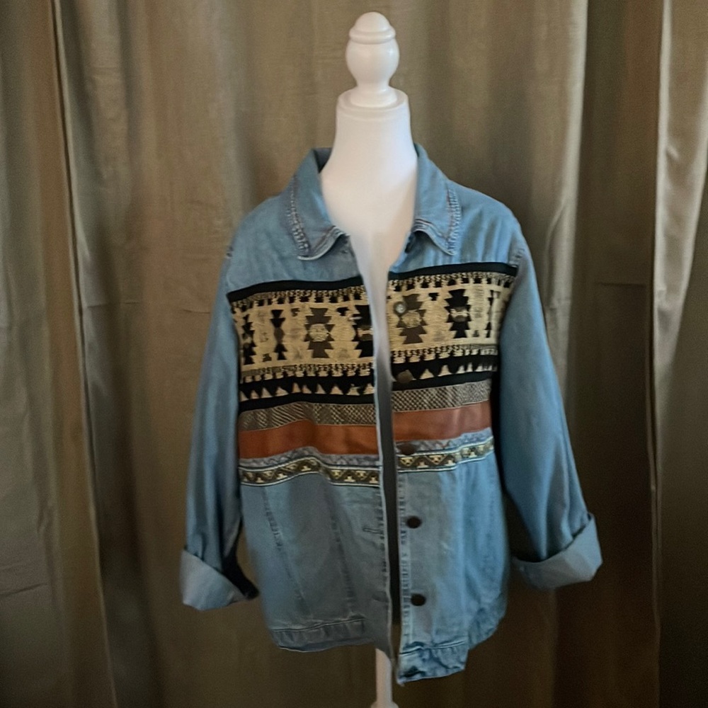 Beautiful jean jacket with western/boho details.
